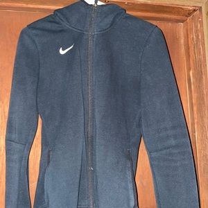 Small black Nike warm up jacket.